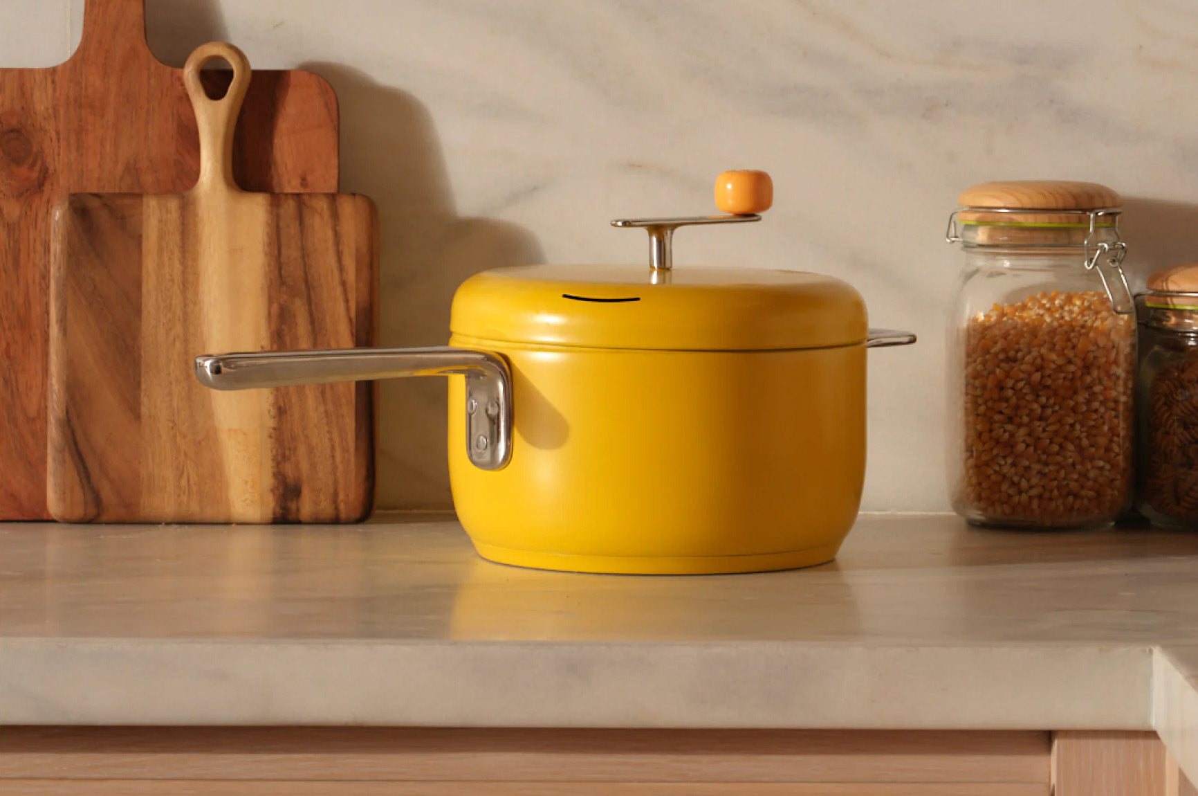 Butter popper sits on a white marble countertop.